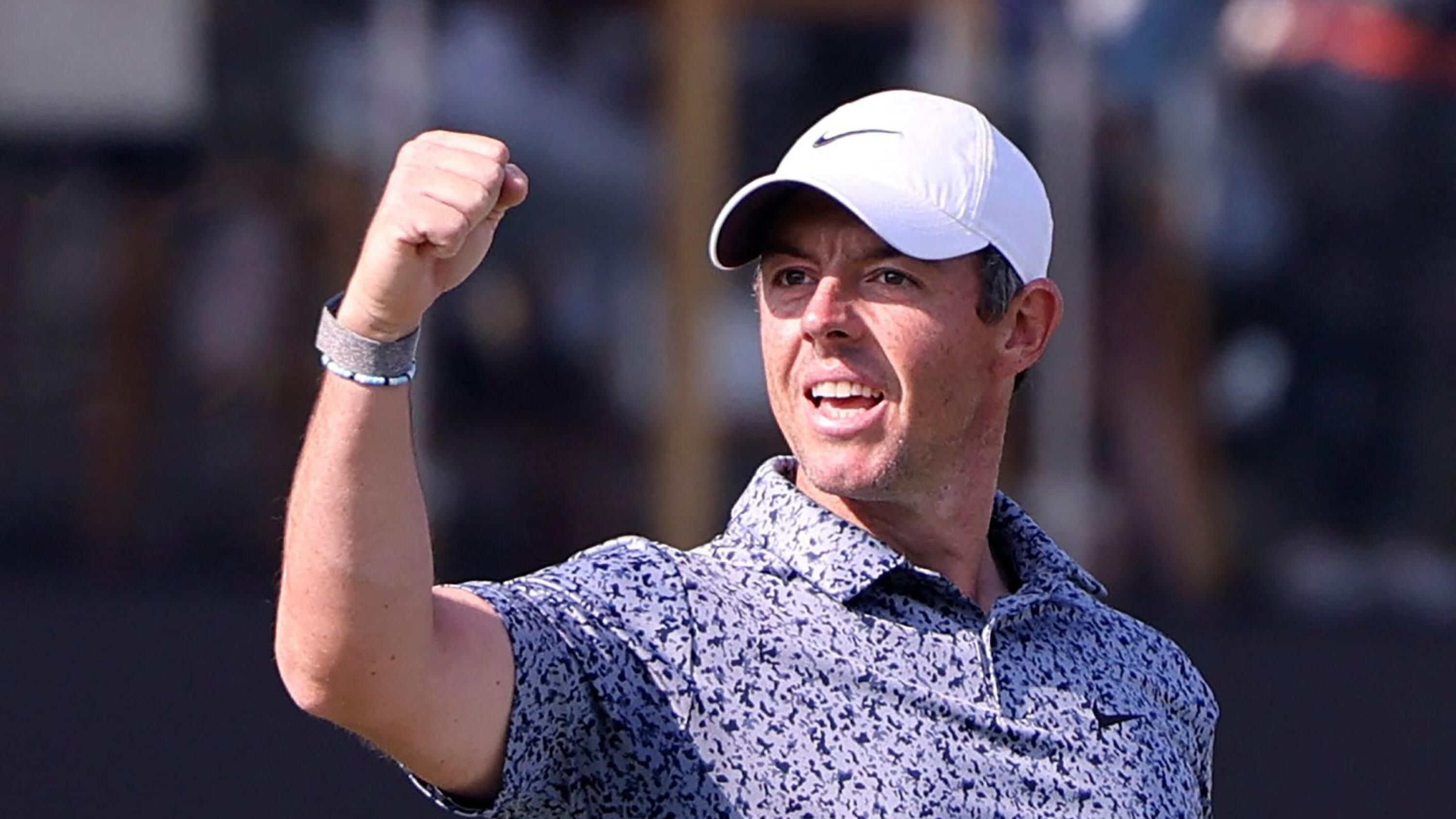 Rory McIlroy celebrates after winning the Dubai Desert Classic at the Emirates Golf Club on Monday.