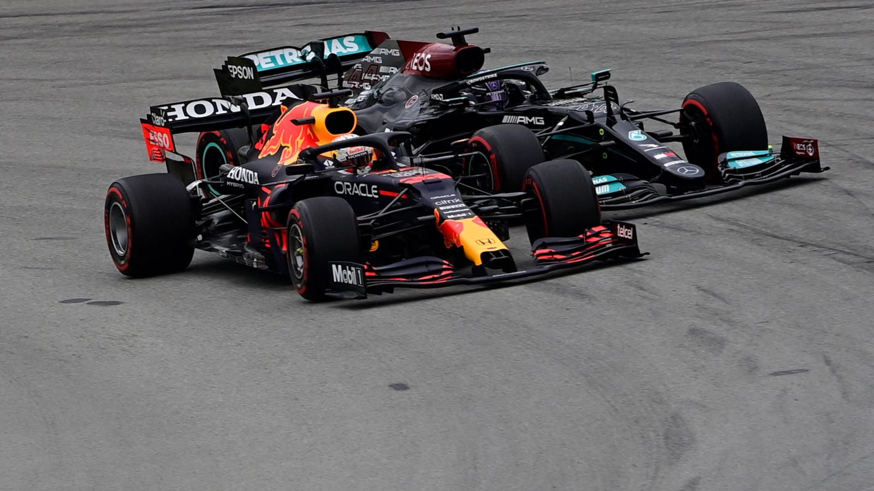 Red Bull's Dutch driver Max Verstappen overtakes Mercedes' British driver Lewis Hamilton at the start of the Spanish Formula One Grand Prix race at the Circuit de Catalunya on May 9, 2021 in Montmelo on the outskirts of Barcelona