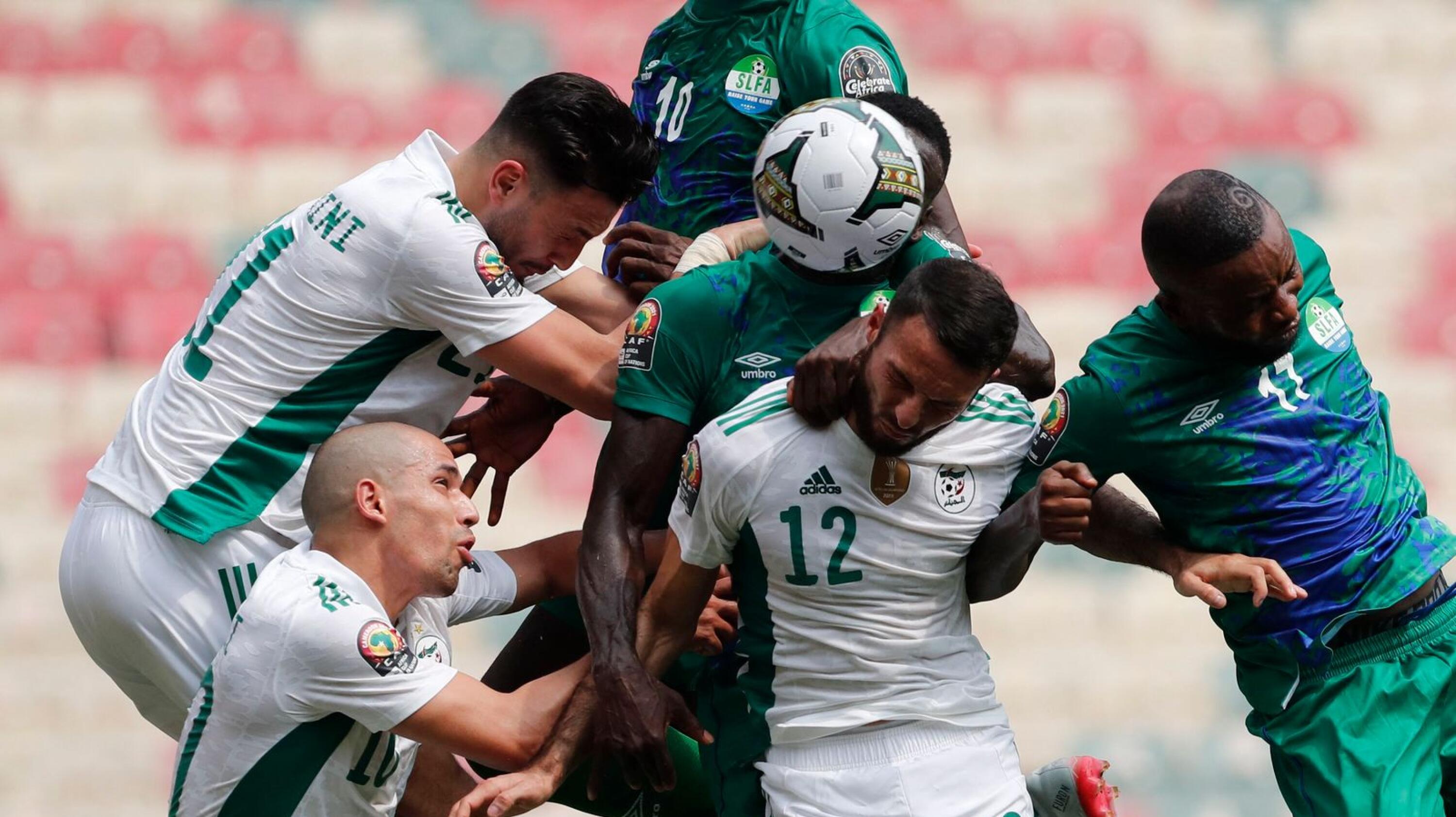 Algeria's and Sierra Leone’s players fight for the ball during their Africa Cup of Nations clash in Douala, Cameroon on Tuesday