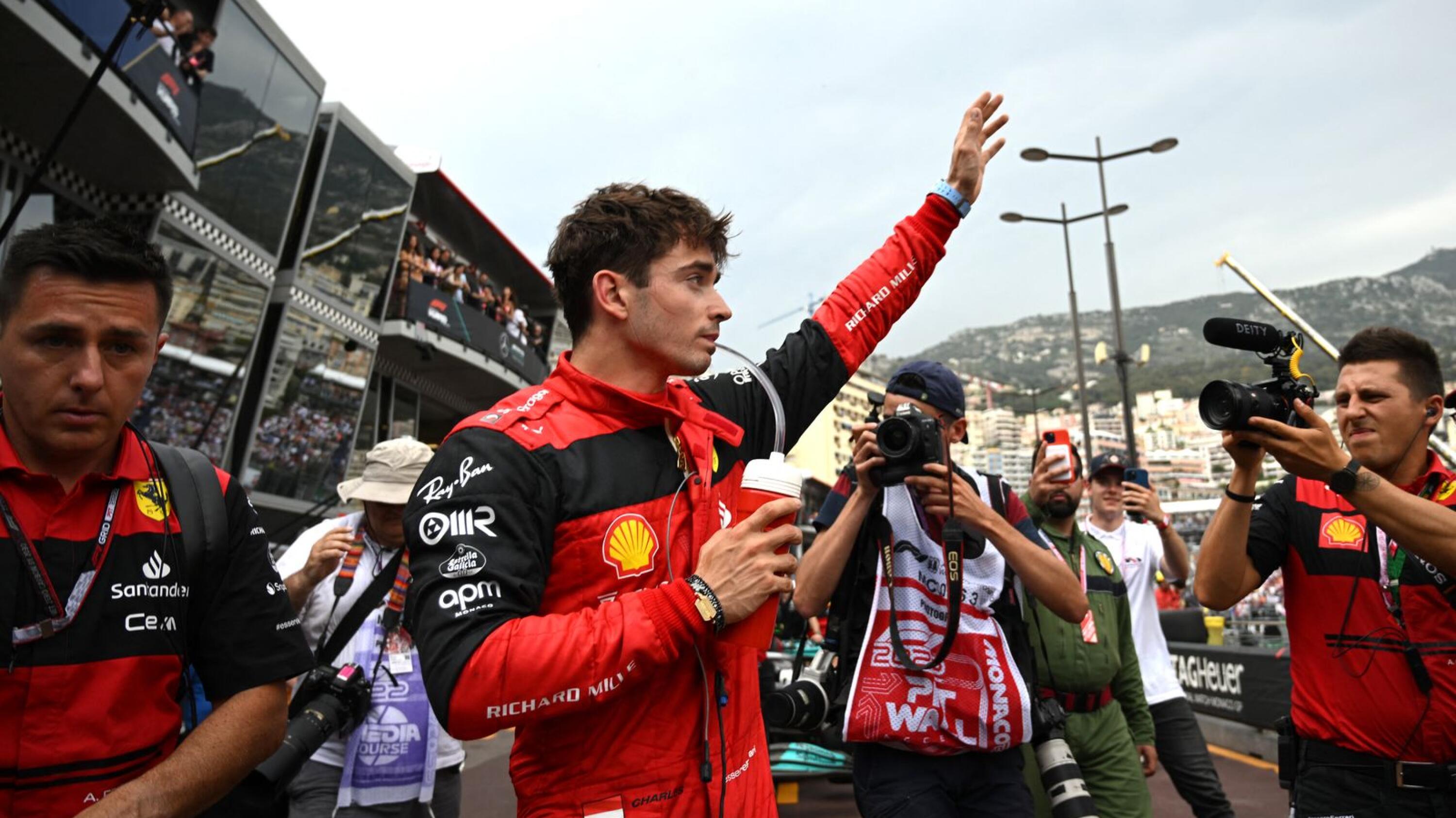 Ferrari's Monegasque driver Charles Leclerc waves in the pit area after the qualifying  session at the Monaco street circuit in Monaco, ahead of the Monaco Formula 1 Grand Prix, on Saturday