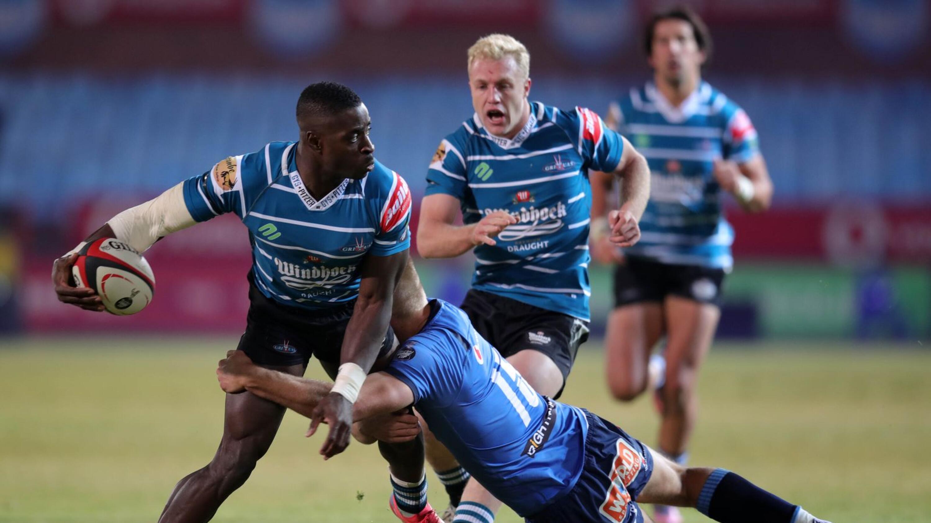 Luther Obi of the Griquas is tackled by Richards Kriel of the Bulls during their Carling Currie Cup semi-final at Loftus Versfeld Stadium in Pretoria on Friday