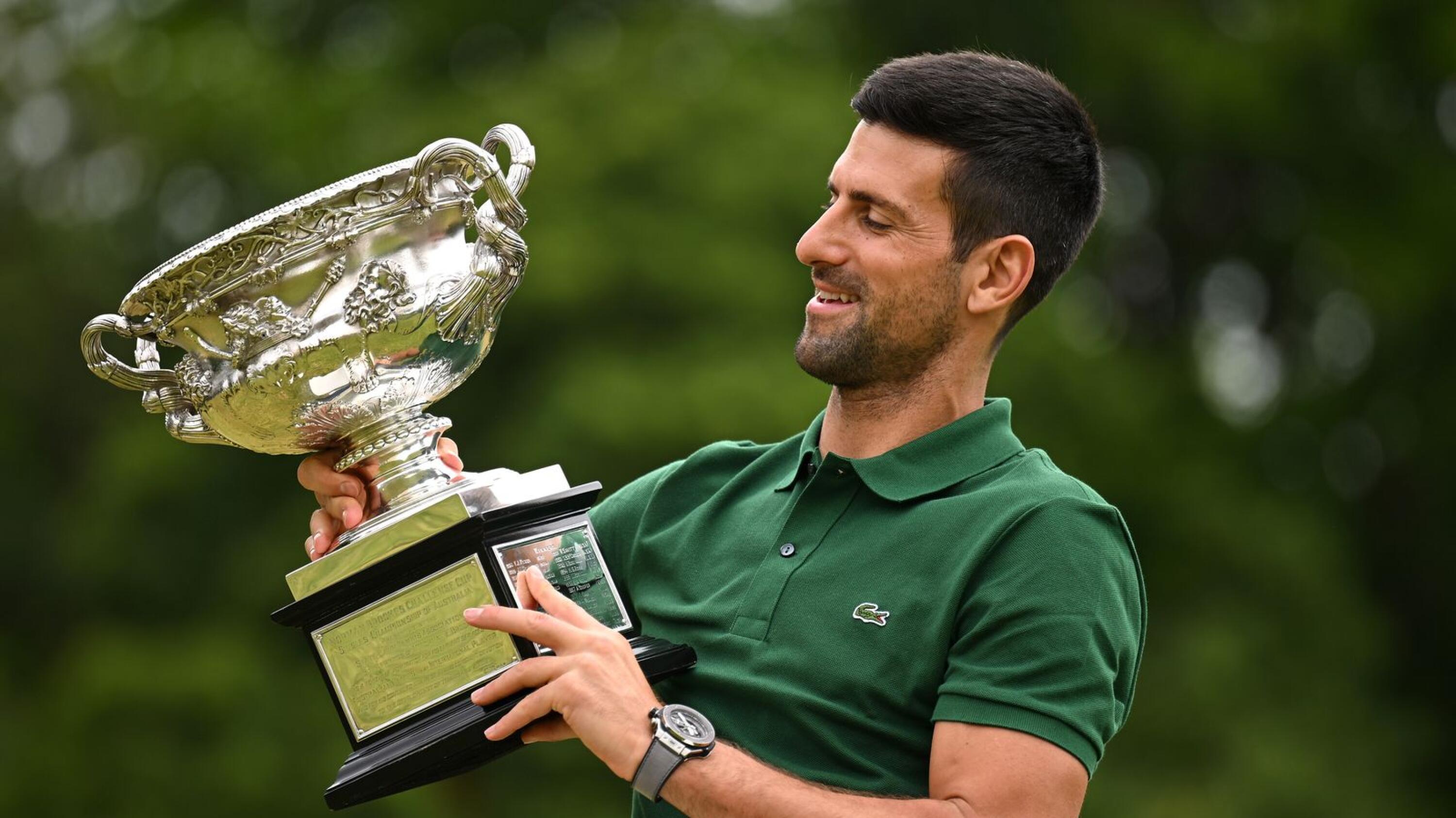 Novak Djokovic of Serbia poses with the Norman Brooks Challenge Cup following his win in the men's singles final in the 2023 Australian Open
