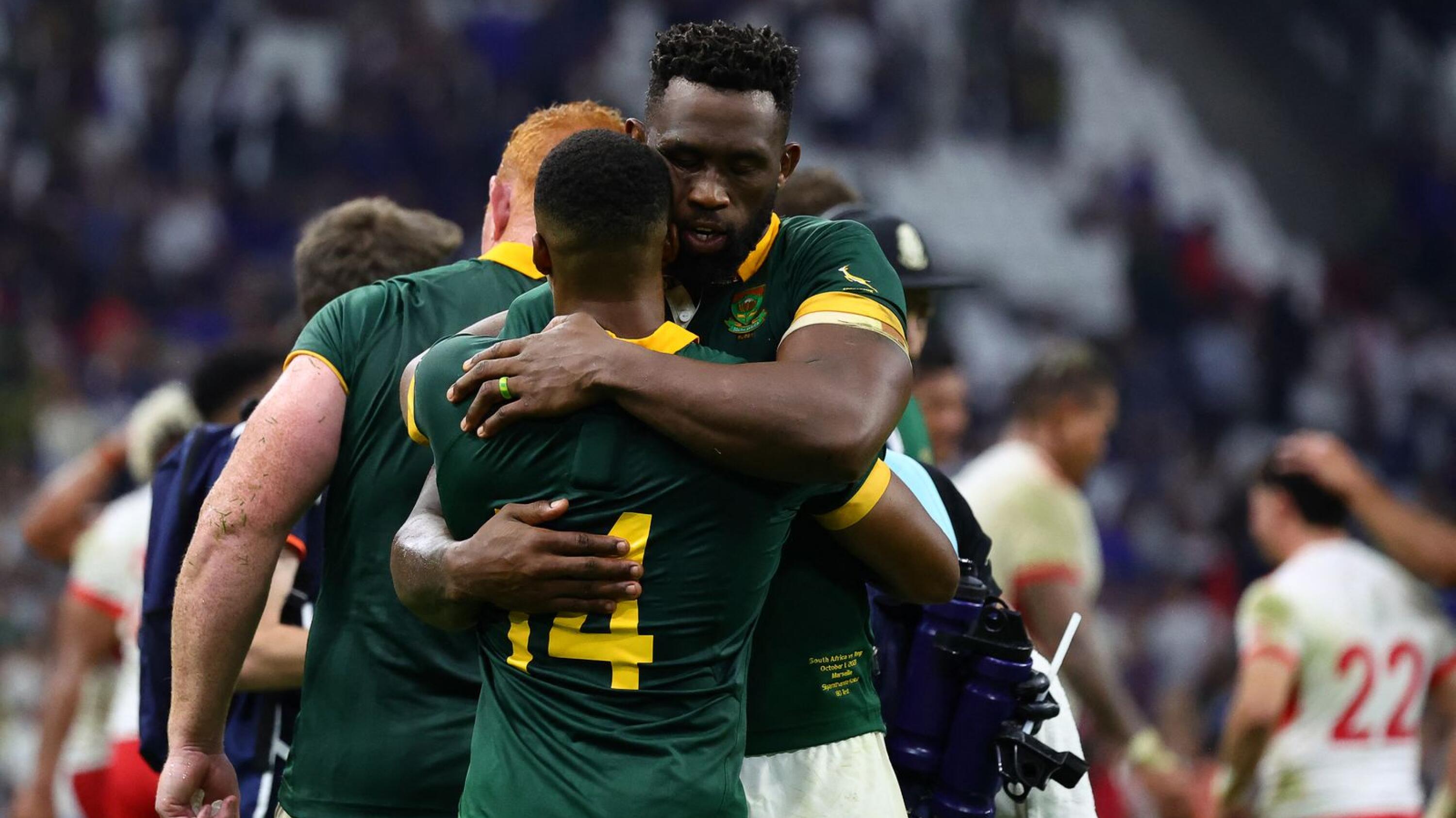 South Africa's blindside flanker Siya Kolisi (R) embraces South Africa's wing Grant Williams after the France 2023 Rugby World Cup Pool B match between South Africa and Tonga at Stade Velodrome in Marseille, south-eastern France
