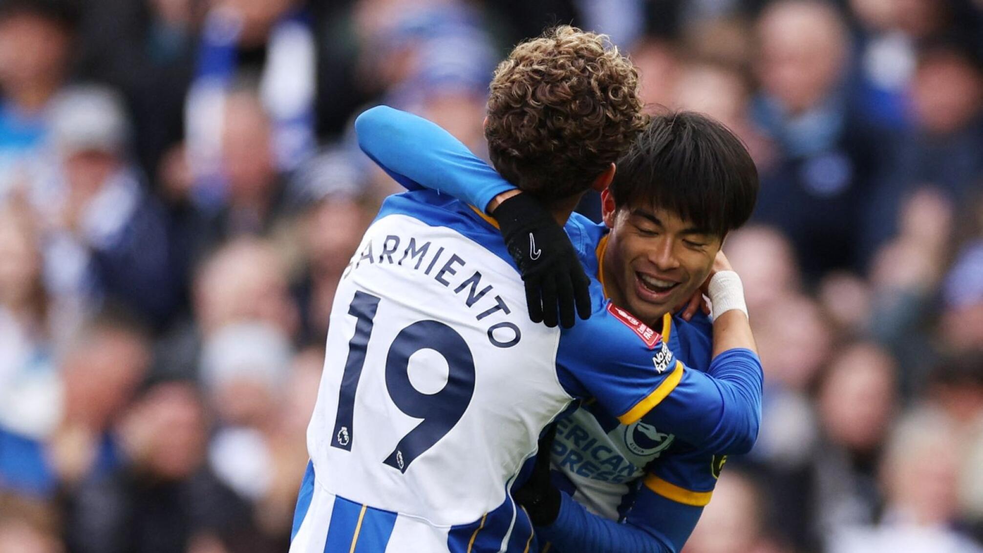 Brighton & Hove Albion's Kaoru Mitoma celebrates with Jeremy Sarmiento after scoring their fifth goal in their FA Cup quarter-final clash against Grimsby at the American Express Community Stadium in Brighton on Sunday