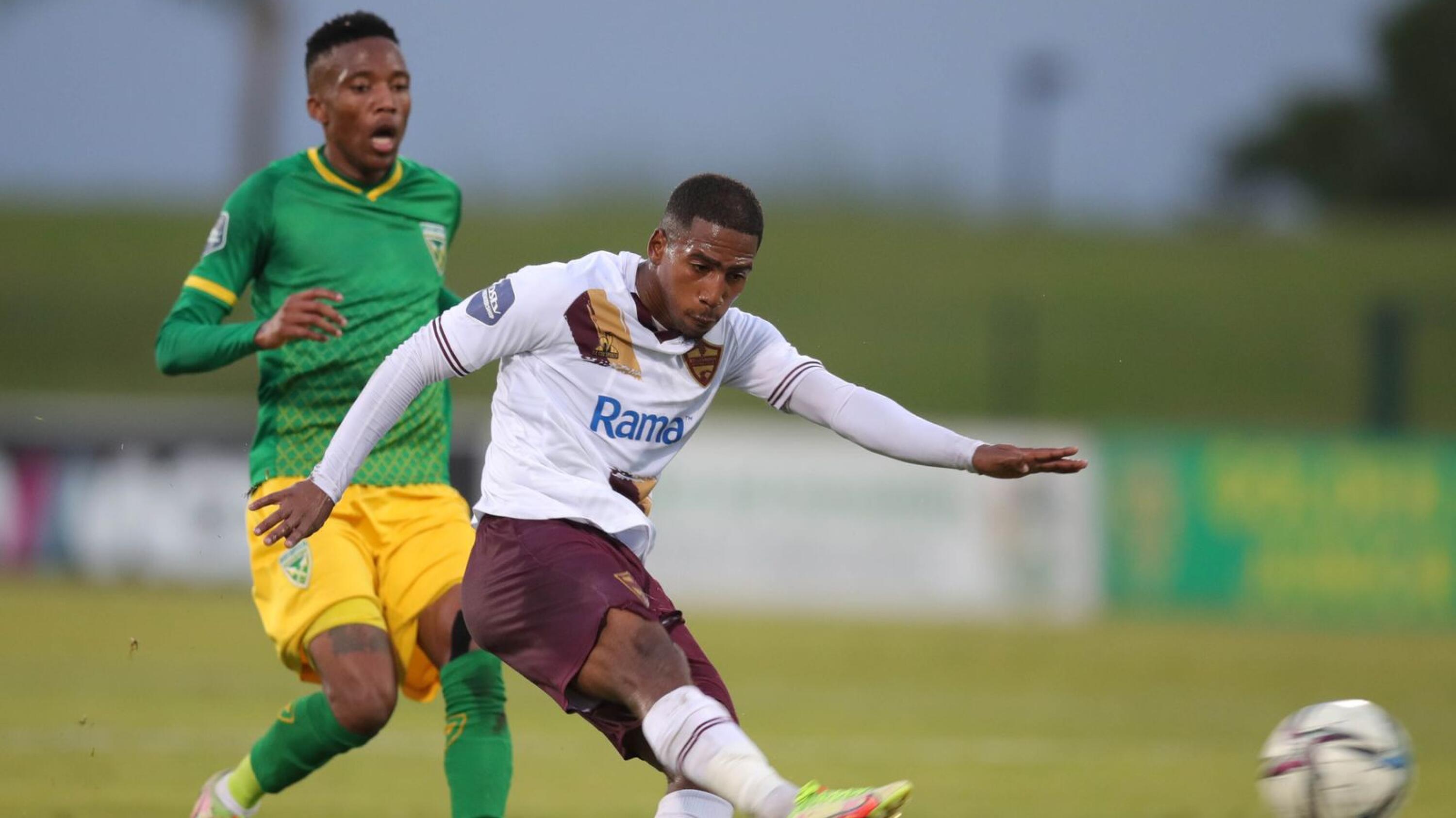 Dean van Rooyen of Stellenbosch FC is challenged by Pule Mmodi of Golden Arrows during their DStv Premiership match at Princess Magogo Stadium in Durban on Wednesday evening