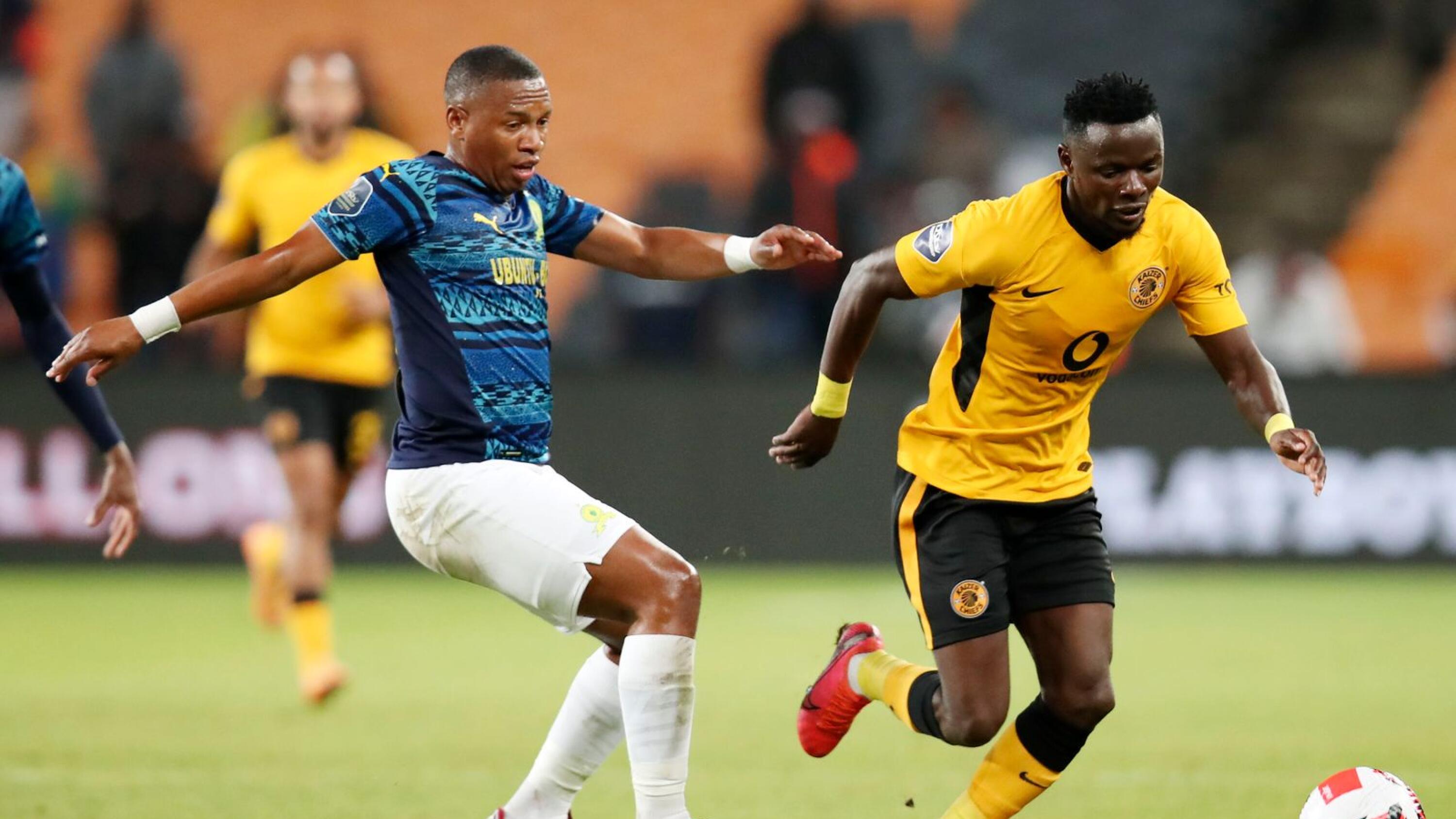 Kaizer Chiefs’ Lazarous Kambole is challenged by Andile Jali of Mamelodi Sundowns during their DStv Premiership match at the FNB Stadium in Johannesburg on Sunday
