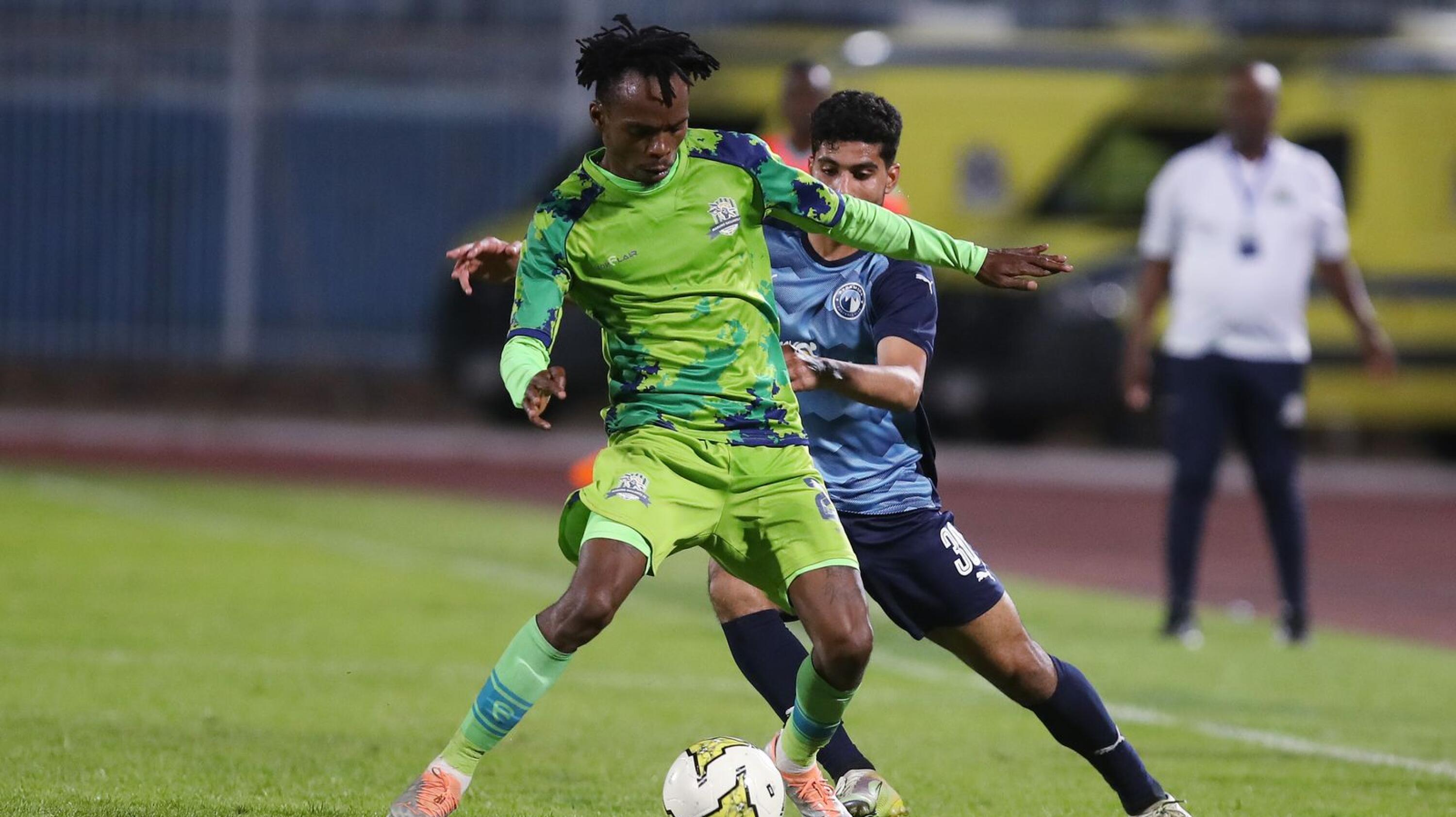 Mpho Mvelase of Gallants challenges Abdelrahman Sayed Semida of Pyramids FC  during the CAF Confederation Cup 2022/23 match between Pyramids and Marumo Gallants held at 30 June Stadium in Cairo, Egypt