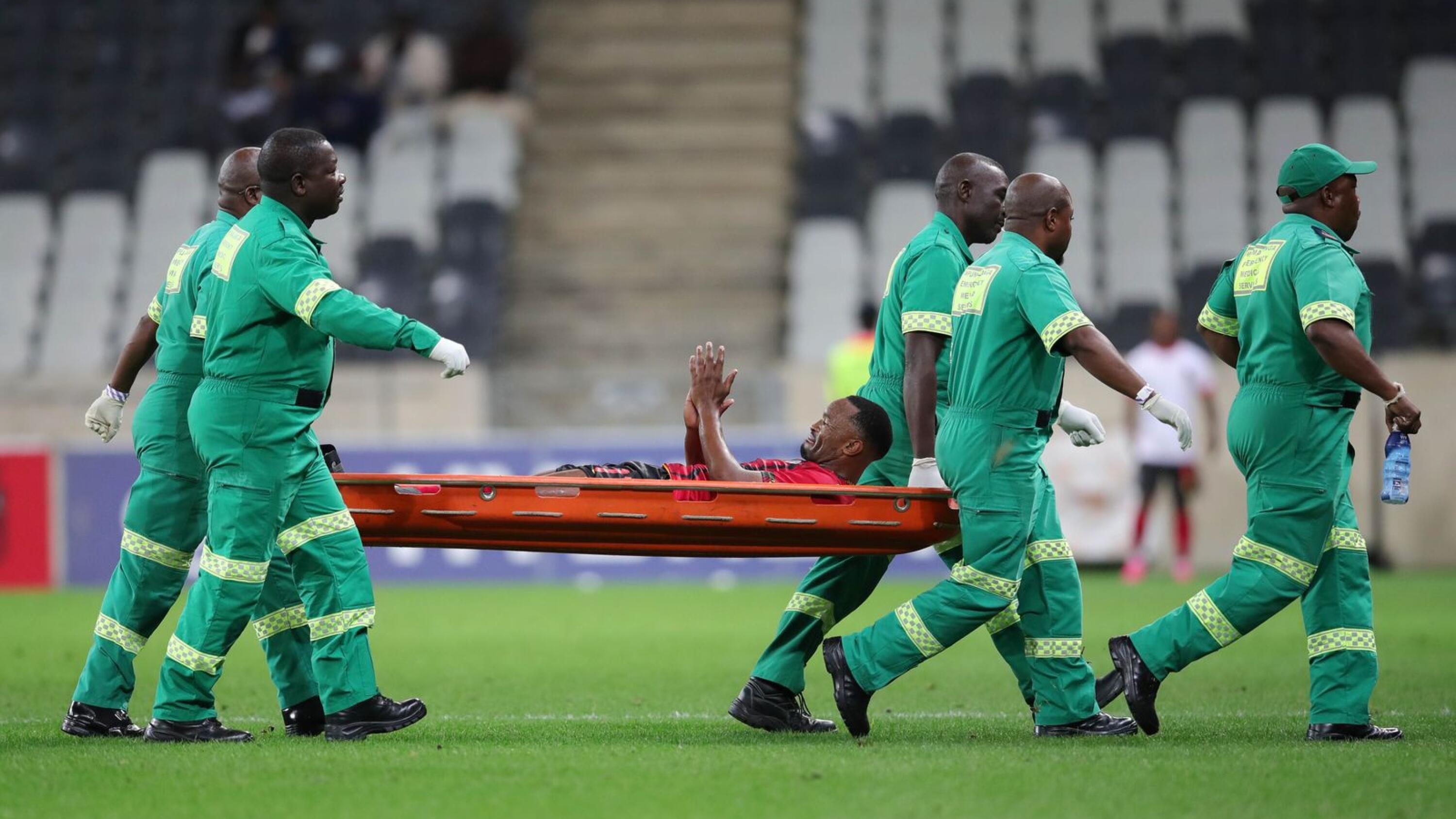 Bernard Parker of TS Galaxy leaving the field injured after he was tackked by Mamelodi Sundowns Bongani Zungu