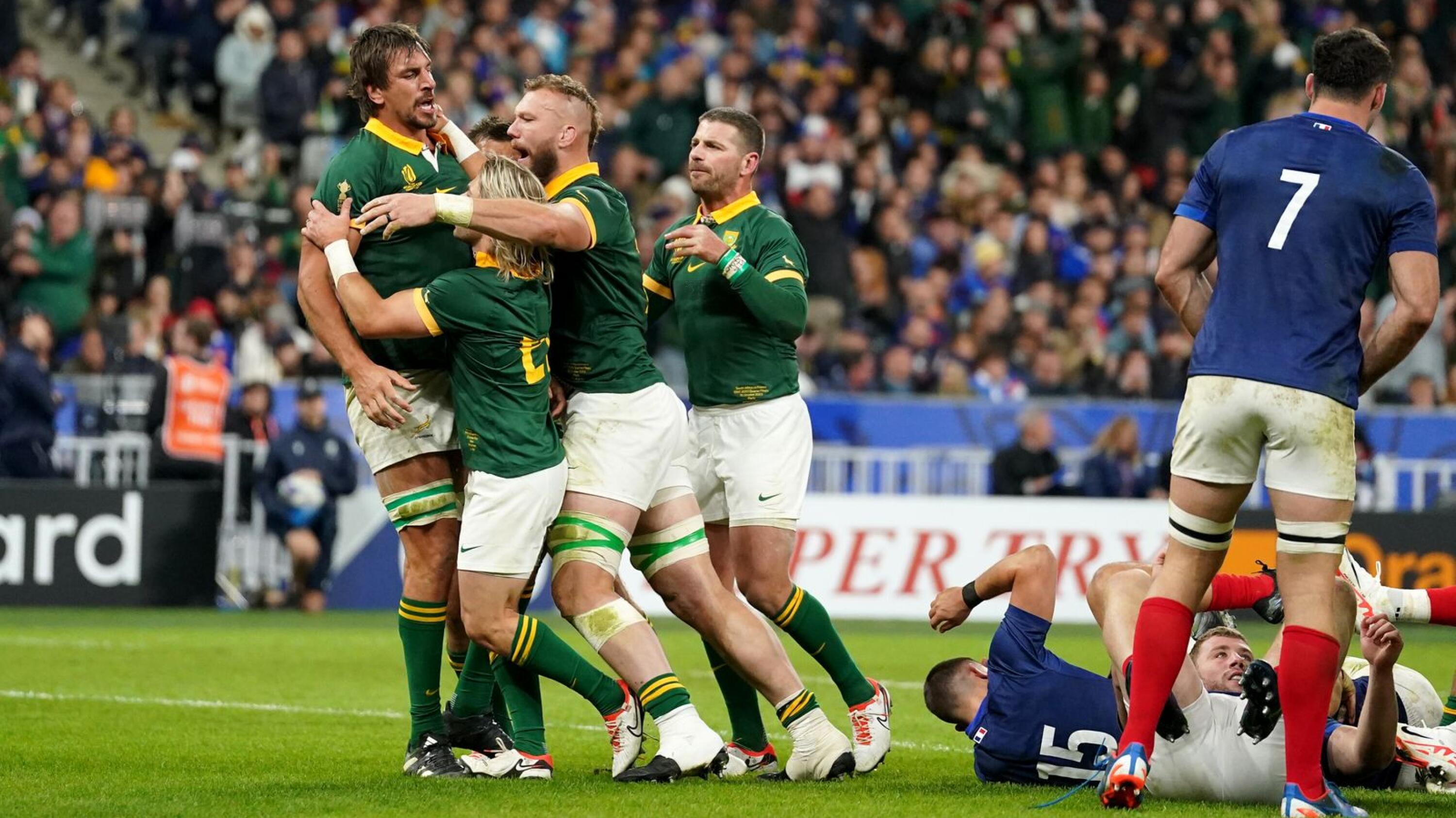 Eben Etzebeth celebrates with his teammates after scoring their fourth try against France in the Rugby World Cup quarter-finals.
