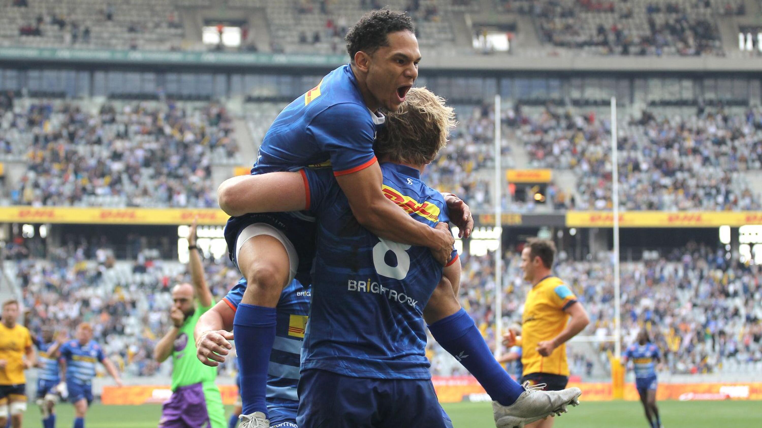 Herschel Jantjies of Stormers congratulates Evan Roos of Stormers for scoring a try during their United Rugby Championship semi-final against Ulster at Cape Town Stadium in Cape Town on Saturday