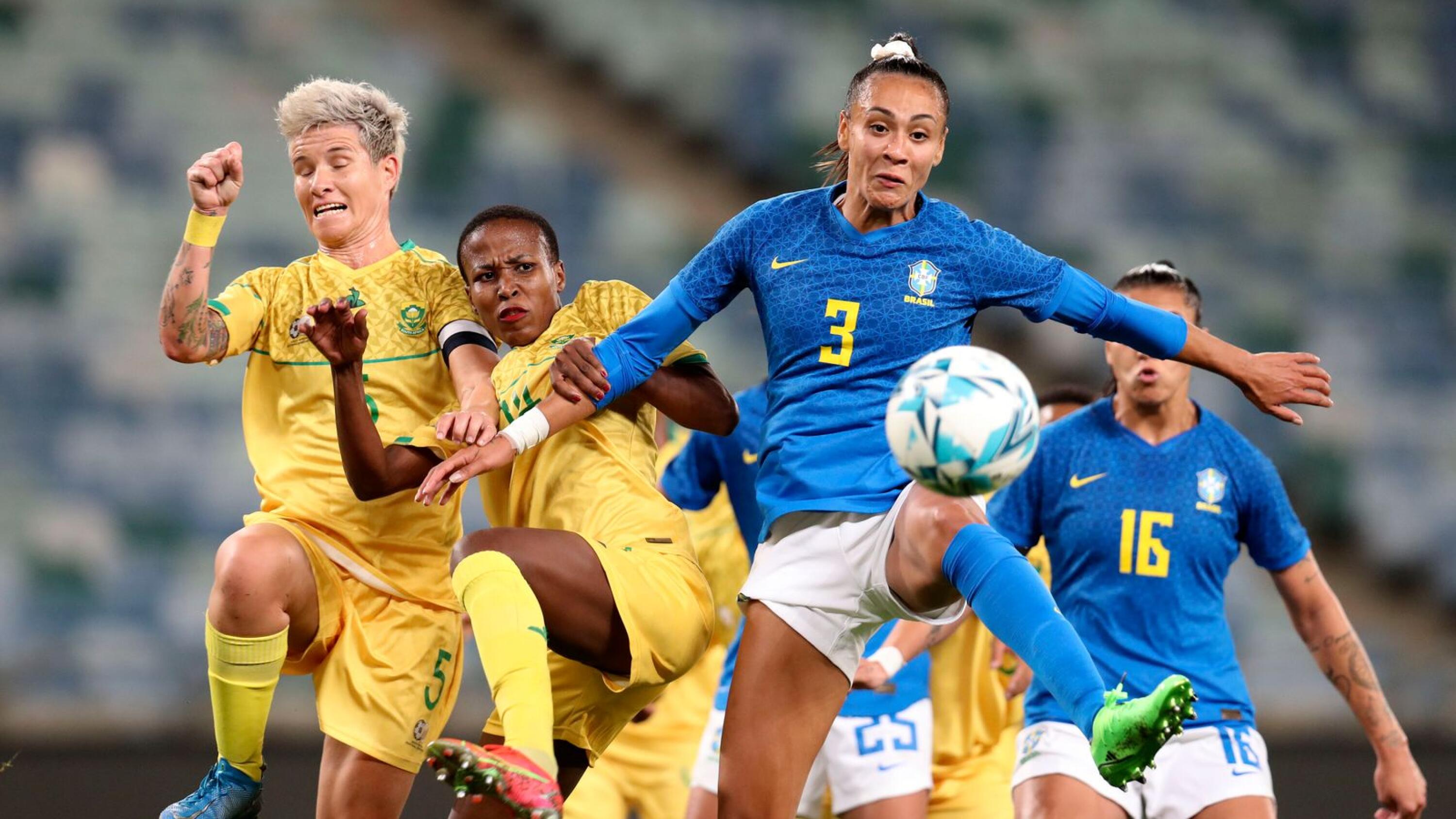 Kathellen of Brazil is challenged by Janine van Wyk and Nomvula Kgoale of SA at Moses Mabhida Stadium on Monday.