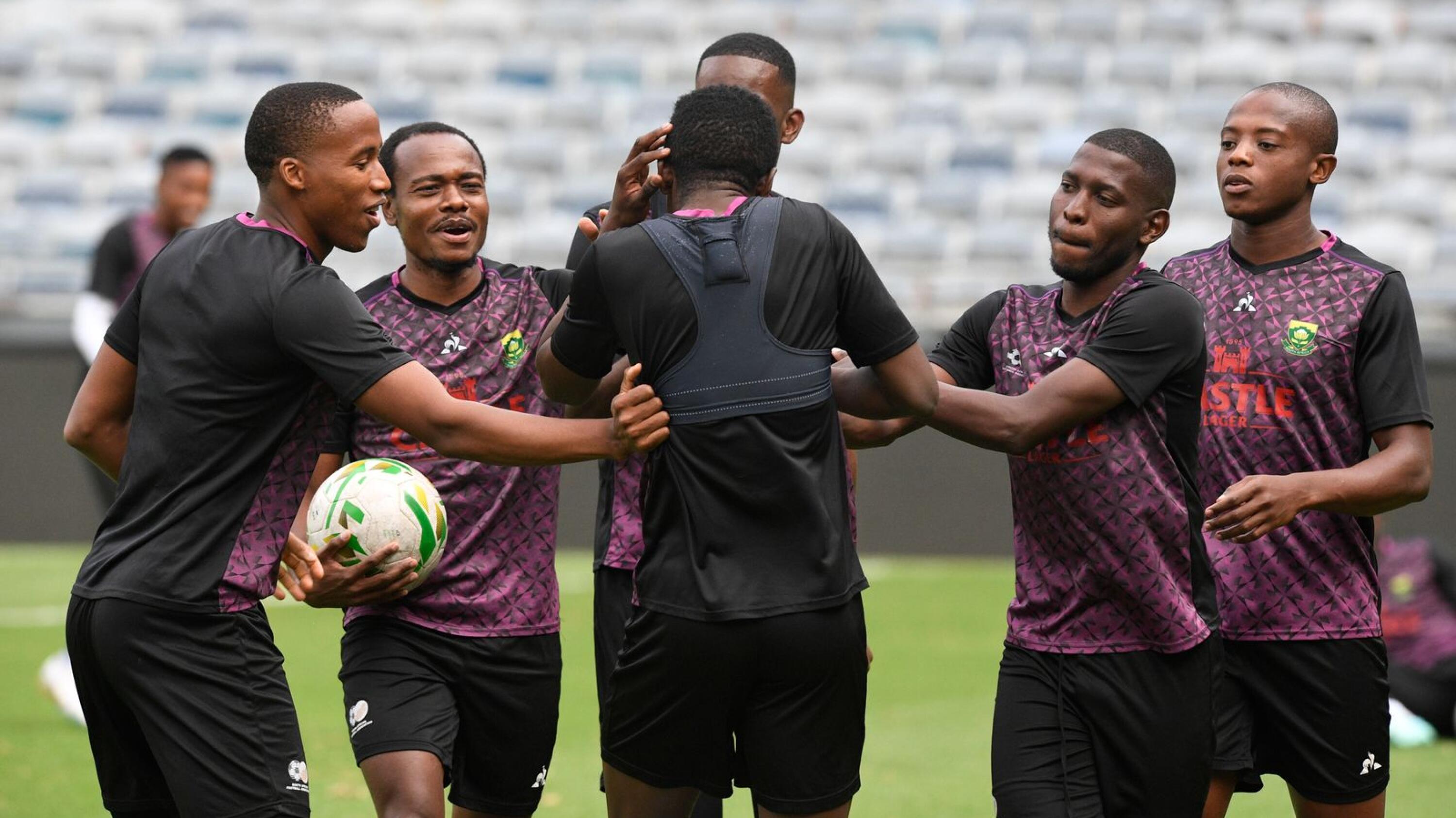 Bafana Bafana players joke around during a training session. 